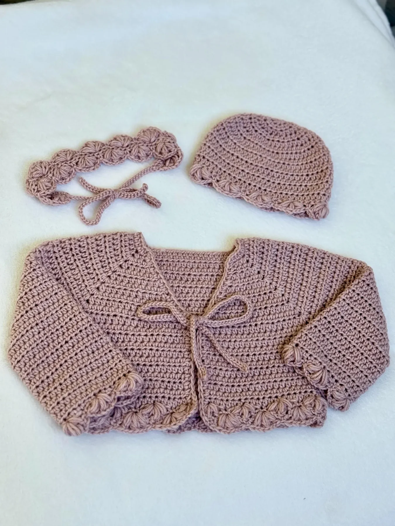 Handmade mauve cardigan, hat, and headband set